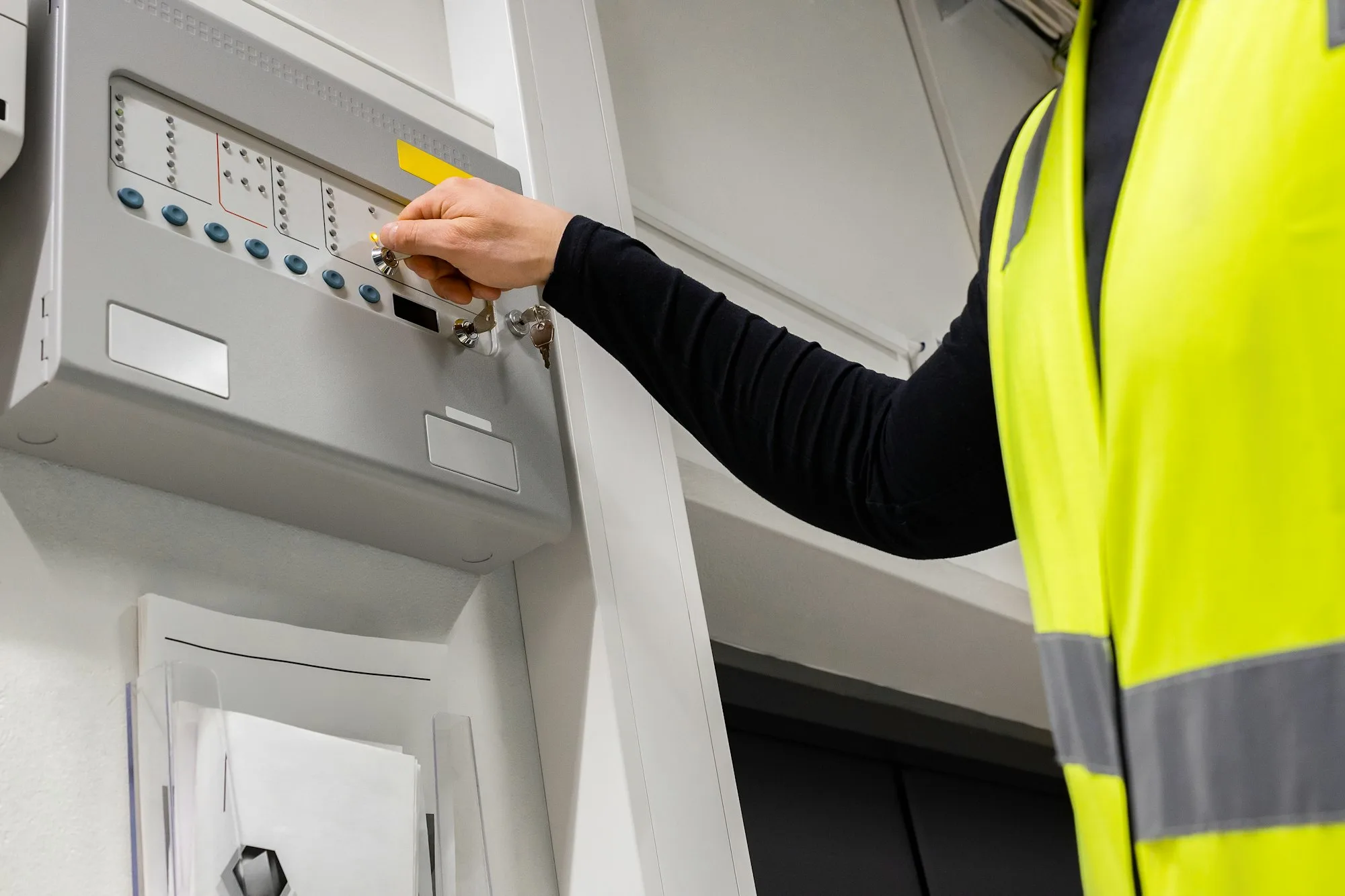 Electrician Opening Fire Panel In Server Room