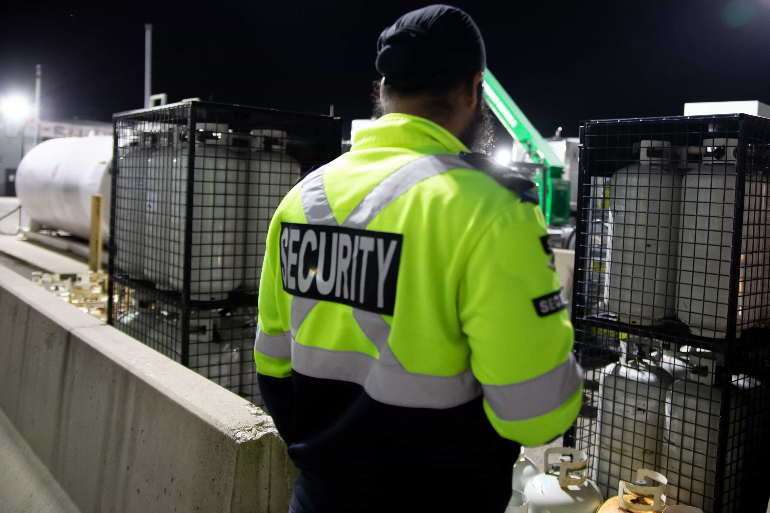 a-security-guard-is-patrolling-a-commercial-storag-2023-11-27-05-13-23-utc